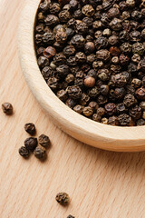 Whole black peppercorns.