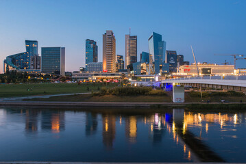 Tall Modern Buildings Reflected on River Neris in Vilnius City