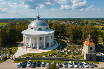 Aerial View of Round Church of the Holy Trinity Building Surrounded by Cemetery in Suderve Town Near Vilnius