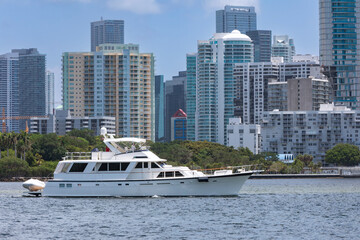 luxury yachts in the bay with Miami in the background