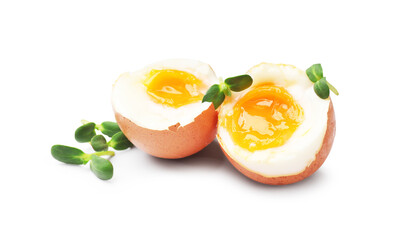 Soft boiled eggs with microgreens on white background