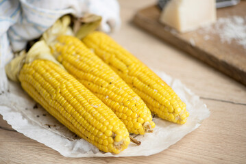 Aromatic organic boiled corn with parmesan for a vegan snack.