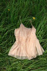 Elegant summer dress on green grass for outdoor gatherings