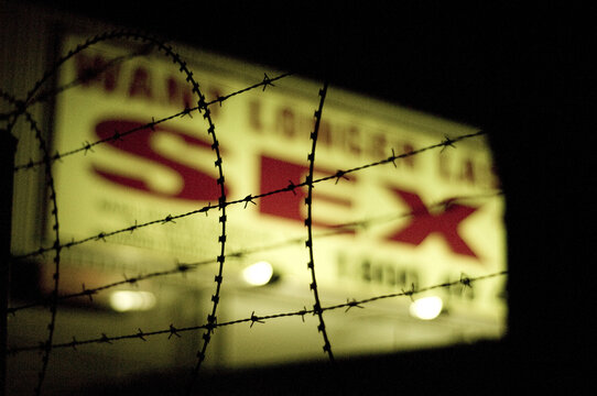 Neon sign and barbwire