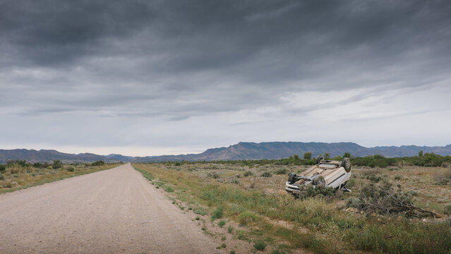 A car rolled over after having an accident on a rural road