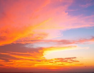 A vibrant orange sky at sunset, with hues of deep amber and soft coral blending together, creating a stunning backdrop for silhouetted clouds.
