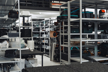 Storage area filled with camera equipment and accessories in a well-organized warehouse