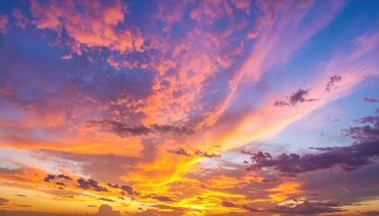 Fototapeta premium A breathtaking sunset over the ocean, with vibrant hues of orange, pink, and purple reflecting off the water, while fluffy clouds drift lazily above.