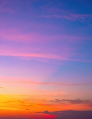 Obraz premium A vibrant blue sky stretches overhead, dotted with fluffy white clouds that drift lazily, creating a serene and peaceful atmosphere.