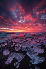 Sunset on the beach with ice and rocks, colorful, cold, red, sand, black, clouds. Generated by AI.