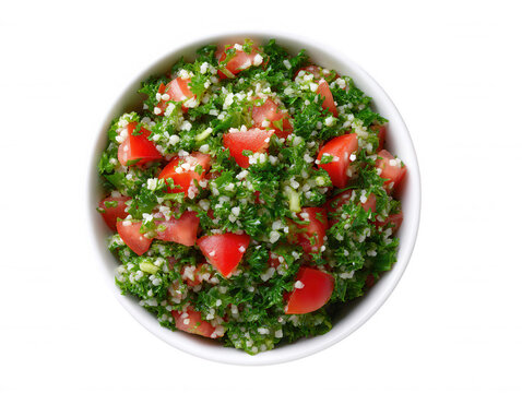 Overhead view shows a bowl of fresh tabbouleh salad with chopped parsley, diced tomatoes, and buur wheat, served against a clean white background for lunch.