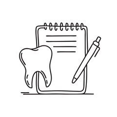 A single tooth placed near a notepad and pen