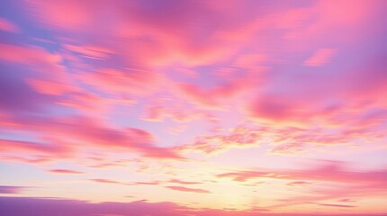 Obraz premium Pink and purple sky with clouds showing a sunset or sunrise with a golden hue