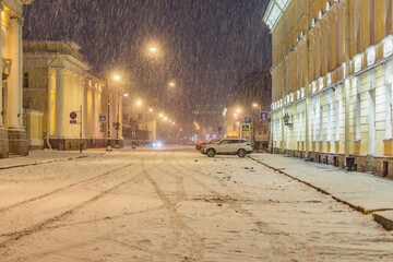 City street of the historical center at snowfall time.