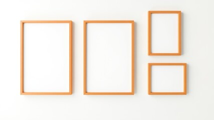 Gallery wall with four picture frames of different sizes in a warm orange hue on a clean white wall creating a simple, modern aesthetic