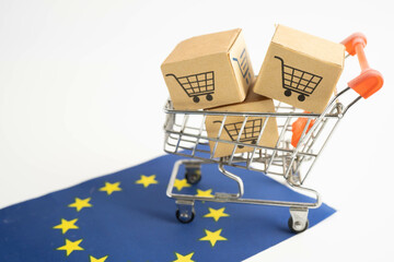 Online shopping, Shopping cart box on EU European Union flag, import export, finance commerce.