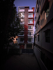 Modern Apartment Building Exterior with Red Accents