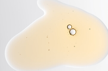 Textured background of cosmetic moisturizing gel or skin serum