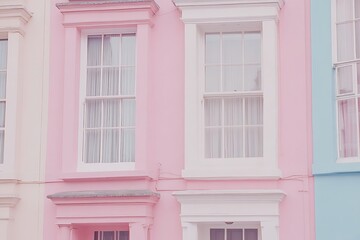 Colorful terraced houses boast beautiful pastel shades and white window trim in an inviting urban scene