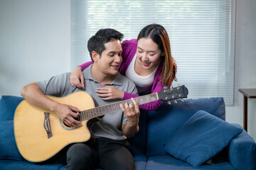 A man and a woman are sitting on a couch