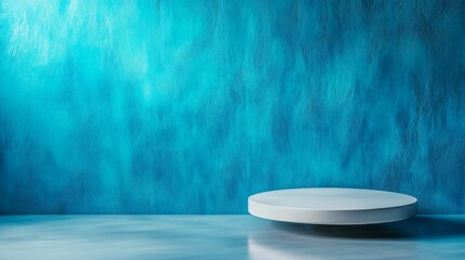 Minimalist white product stand against textured blue wall background, ideal for display marketing showcase.