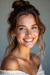 Woman with a happy mood smiling against a neutral background with copy space.