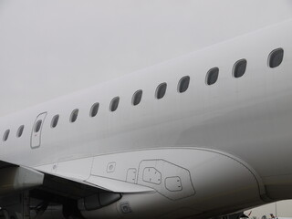 The airplane has a lot of windows and is white