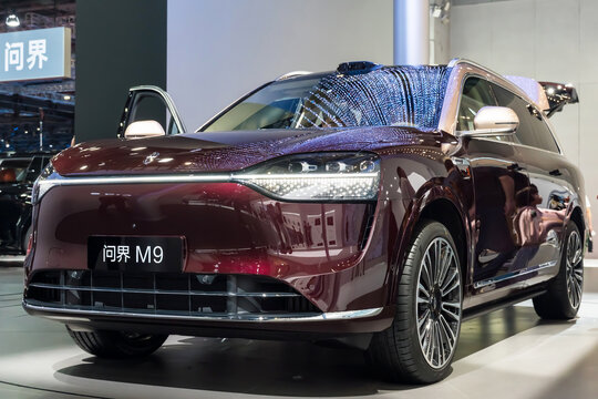 Huawei Aito M9. Visitors admire the Huawei Aito M9 at an automotive exhibition in Shanghai, exploring its design and features. China, Shanghai May 2, 2025.