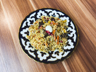 A plate of food with rice and meat on it
