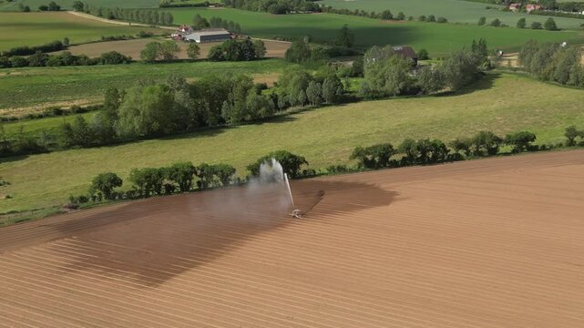 4k drone footage of farmland being irrigated near Bures in Suffolk, UK