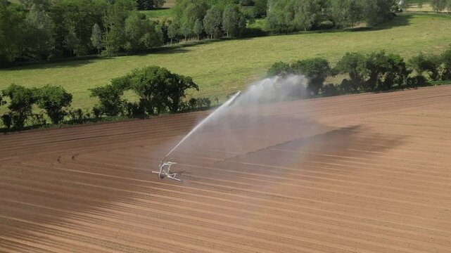 4k drone footage of farmland being irrigated near Bures in Suffolk, UK