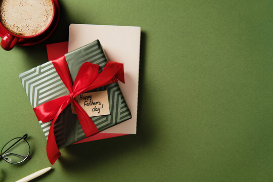 Father's day gift and coffee on green background