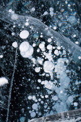 Gas methane bubbles frozen in blue ice of lake Baikal