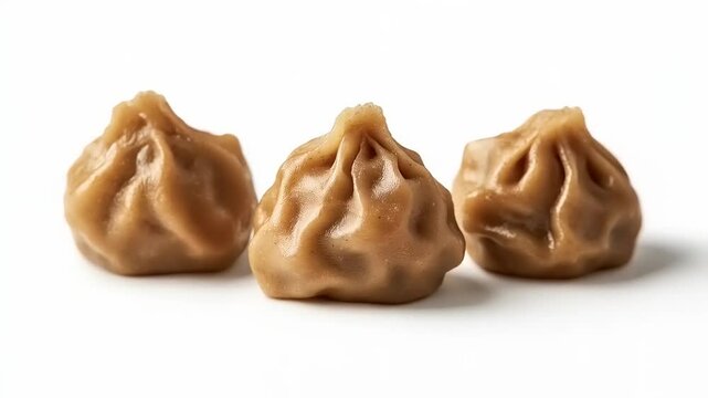 Close-Up of Three Deliciously Dumpling on Clean White Surface Showcase