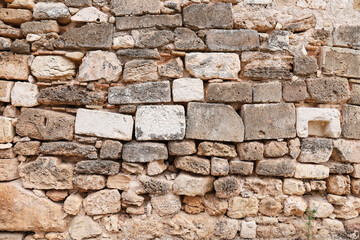 Obraz premium Texture of grey eroded stone on wall