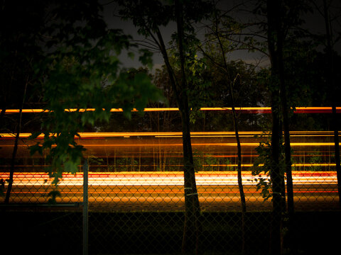 Roadside long exposure light trails at night