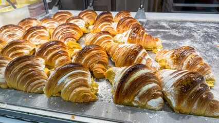 Golden croissants bask in buttery glory, evoking French Epiphany delights and peculiar Pancake Day...