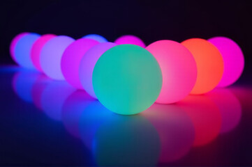 A collection of luminous spheres resting on a flat surface, perfect for depicting futuristic or mystical themes