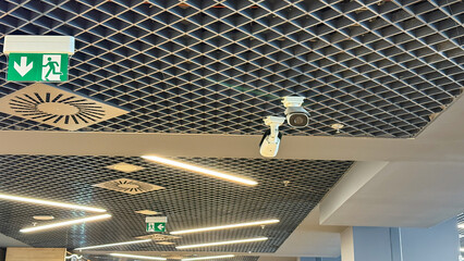 Intricate lattice ceiling with vigilant security cameras, evoking Cyber Security Awareness Day and...