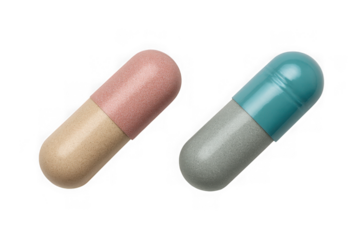 Two capsules of medicine isolated on transparent background