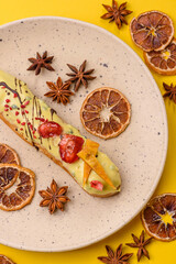 French food, dessert eclair with chocolate filling. Eclair as a background