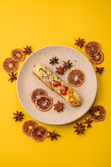 French food, dessert eclair with chocolate filling. Eclair as a background
