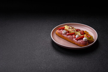 French food, dessert eclair with chocolate filling. Eclair as a background