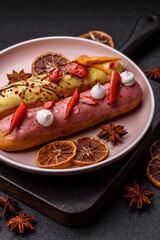 French food, dessert eclair with chocolate filling. Eclair as a background