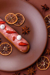 French food, dessert eclair with chocolate filling. Eclair as a background