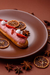 French food, dessert eclair with chocolate filling. Eclair as a background