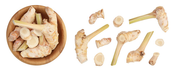 Fresh galangal root in wooden bowl isolated on white background with full depth of field. Top view. Flat lay