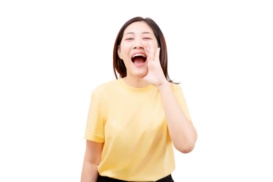 Asian young beautiful smiling in a yellow shirt is shouting with her hand next to her mouth.