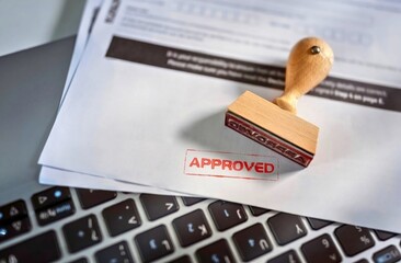 Sanctioned Documents on a Laptop, Paperwork Confirmation and Approval