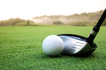 Close-Up of Golf Club and Ball on Lush Green Putting Surface